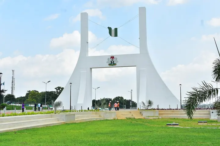 The Abuja City Gate arch on the road into the capital